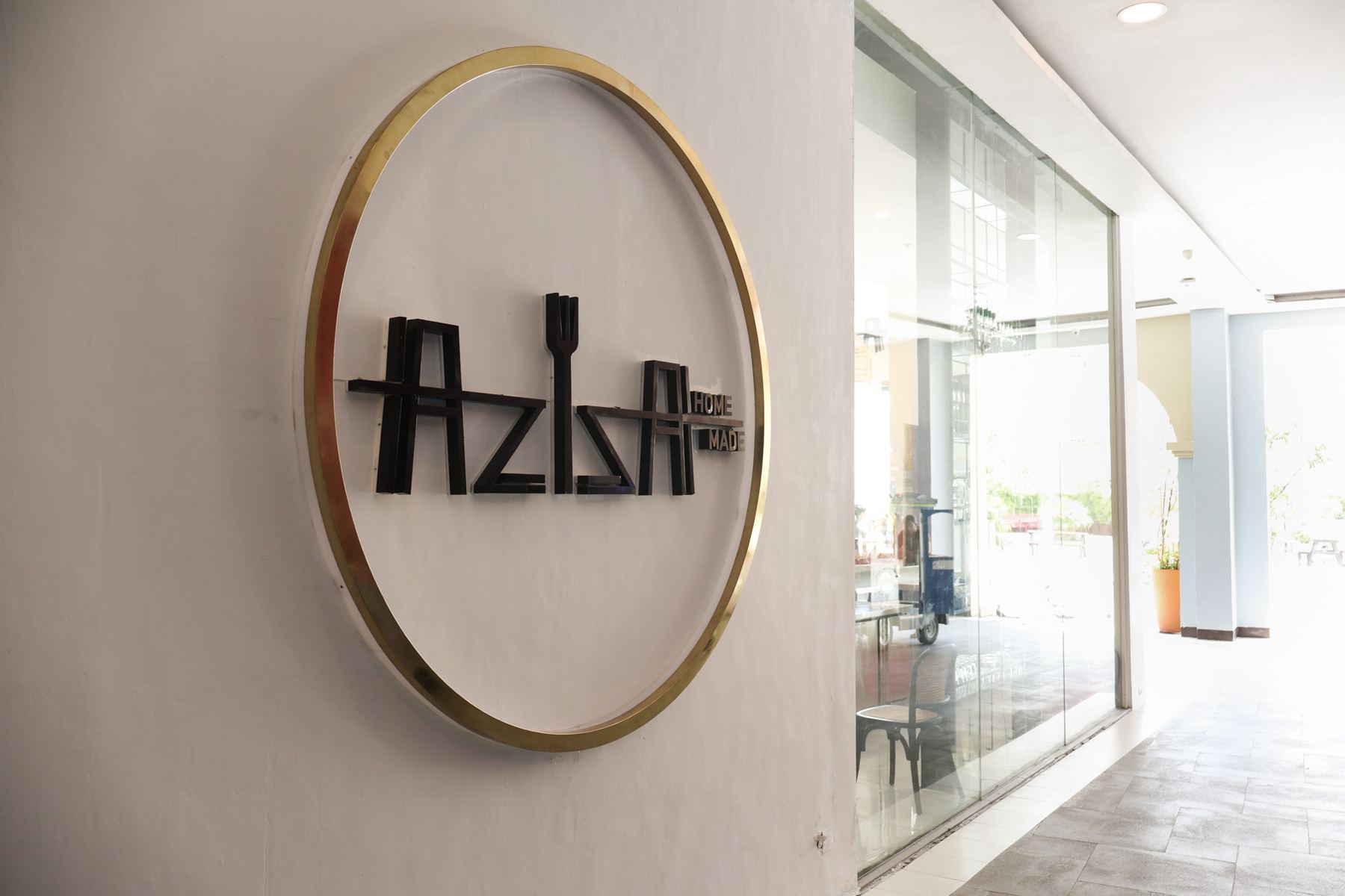 The Aziza mark on the wall of the restaurant